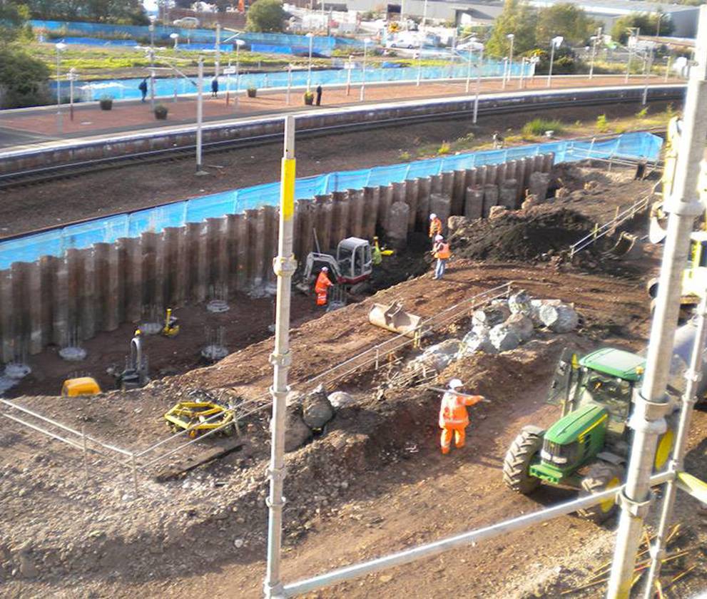 Close-up view of the M74 construction running adjacent to busy railway lines