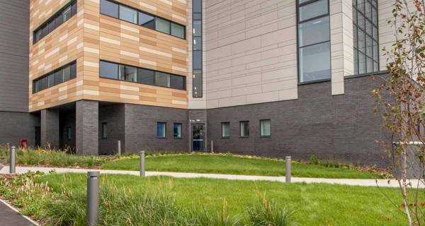 Exterior view of Chase Farm Hospital, showing the modern facade.