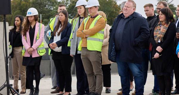 Guests watching concrete pour