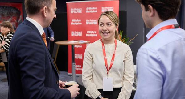 Apprentices talking at conference