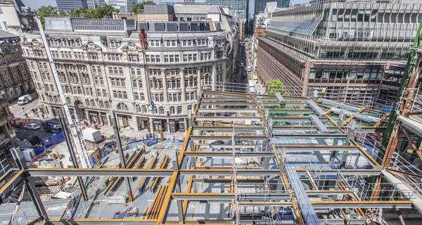 An aerial photograph showcasing the completed 100 Liverpool Street building in the context of its surrounding area