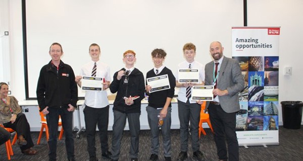 Winning Team with Matt Privett (SRM Geospatial Engineer) left and Peter Headeach (Headteacher IKB Academy) right