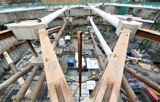 A view into the four-storey basement of Ilona Rose House, with steel frames and concrete slabs under construction