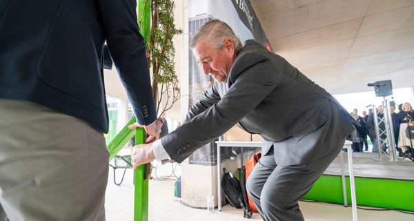 Works Manager, Phil Matthews, nails the evergreen bough to the structure