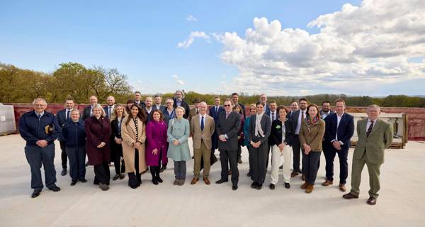 Group photo of the team at the NRC topping out ceremony