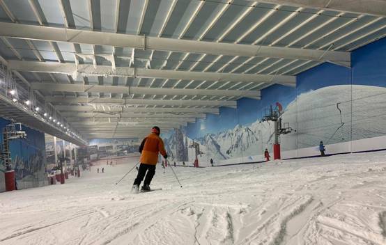 Visitor skiing on the pristine snow slope inside the Snow Centre