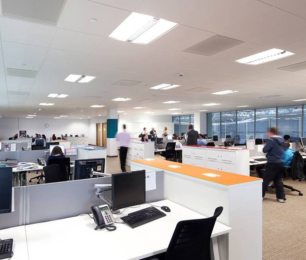 Spacious, open-plan office space within the Emirates Arena, featuring sleek desks, ergonomic chairs, and large windows.