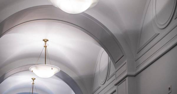 A room view with a focus on the ceiling, revealing ceiling lights and possibly decorative elements