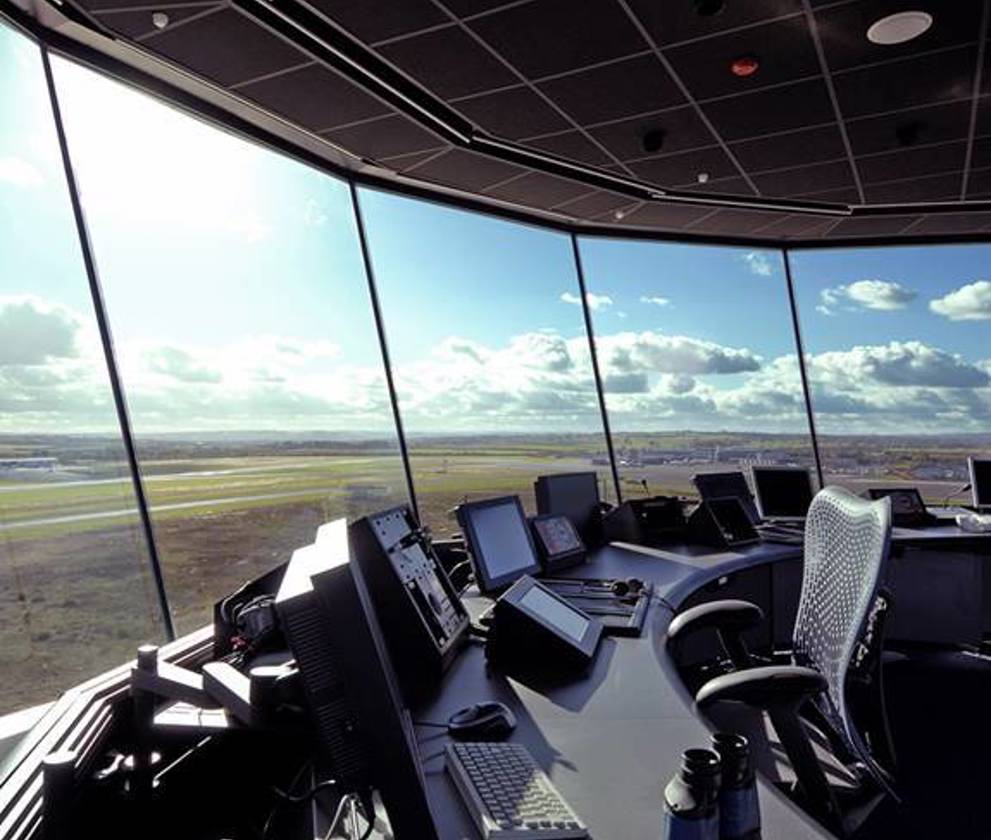 Inside the new control tower at Newcastle International Airport, showcasing the advanced air traffic control systems and panoramic views of the airfield