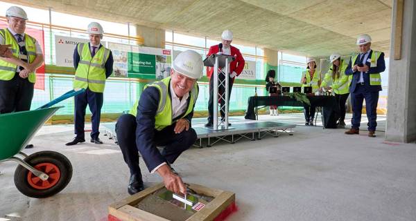 The final concrete pour, marking the structural completion of the tower.