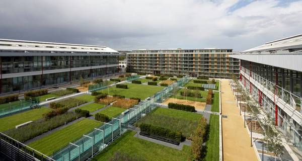 The central garden at Highbury Square, occupying the dimensions of the former football pitch, surrounded by the four main blocks of luxury apartments.