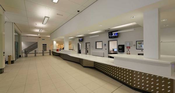 Modern reception area at Sports Central, Northumbria University, with sleek design.