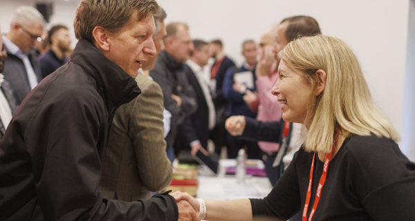 Sir Robert McAlpine representatives engaging with local suppliers at the exhibition area