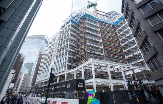 Safety barriers installed around the Fen Court site to protect pedestrians and manage traffic, ensuring public safety during construction.