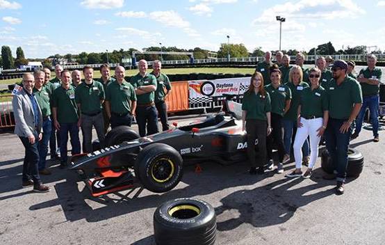 The go-kart event organised to raise money for Maggie's, showing participants and the community involvement