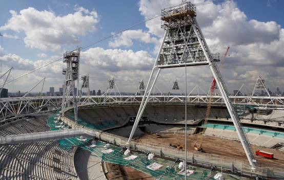 Engineers and construction workers implementing sustainable building practices at the Olympic Stadium