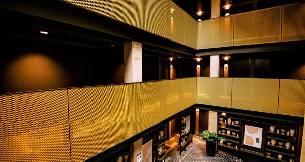 Lobby interior at Mustard Wharf with yellow decor elements, creating a warm and welcoming atmosphere.