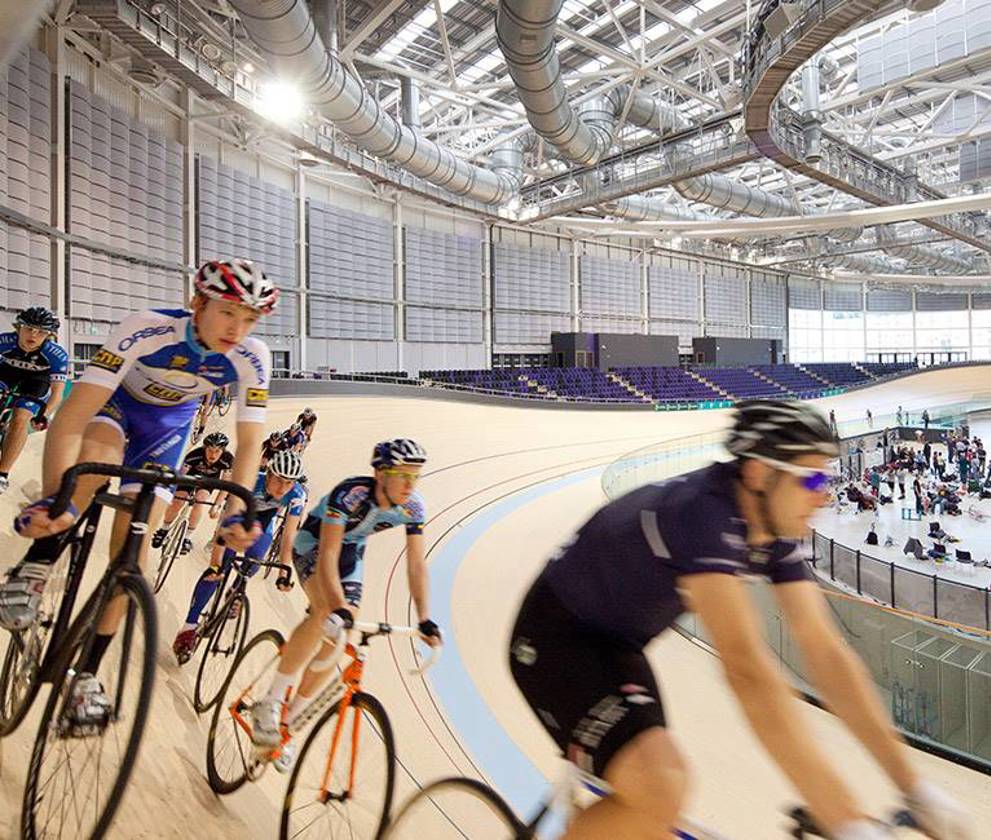 Cyclists biking on the velodrome at the Emirates Arena