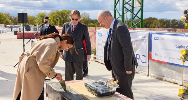 Laying the final piece of cement 