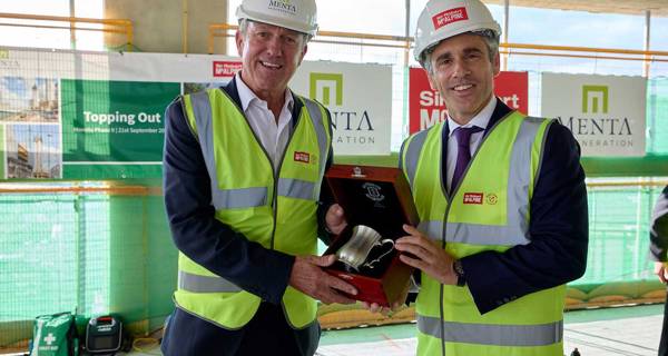 Representative from Menta and Hector McAlpine with topping out Tankard.