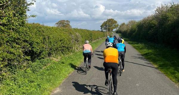 Team cycling along country path