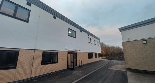 Wide shot of the new building exterior, highlighting its design and scale