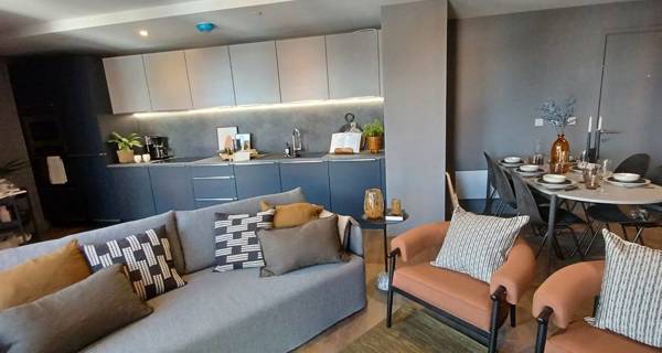 Interior view of a spacious, modern living room in a Tower Works apartment.