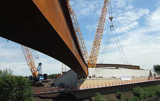 Construction workers assembling the Port Eglinton Viaduct on the M74