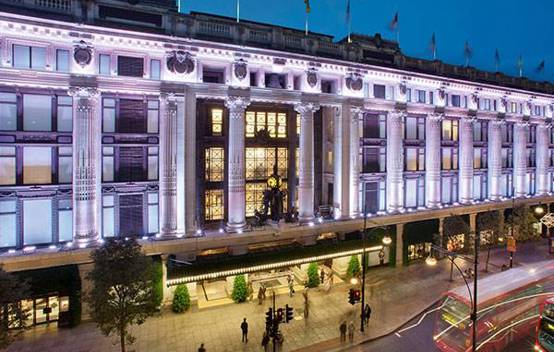 The façade of Selfridges illuminated at dusk, highlighting the new lighting installations that enhance the building’s architectural details