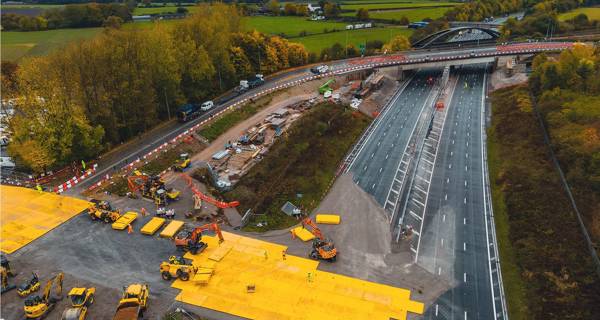 An aerial view of the newly constructed bridge with surrounding landscapes visible.