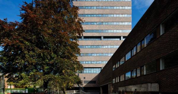 Exterior view of Claremont Tower after refurbishment, showing new brick cladding and windows