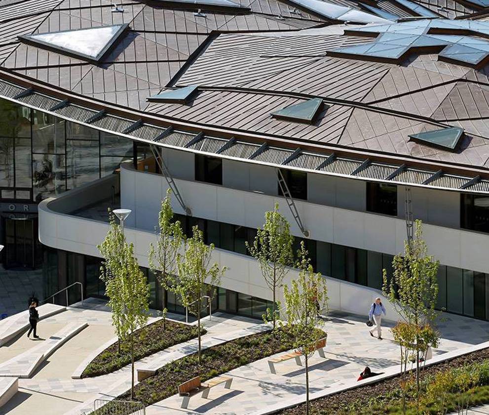 Exterior view of the Exeter Forum with its striking gridshell roof, featuring energy-efficient design elements.